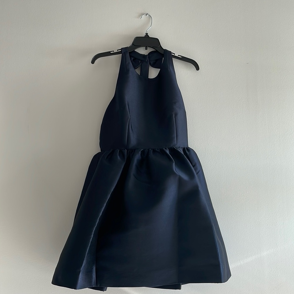 Never worn Kate Spade bow back fit and flare dress. Tags still on